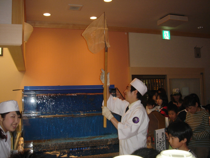 Preparing to net the sacrificial fish