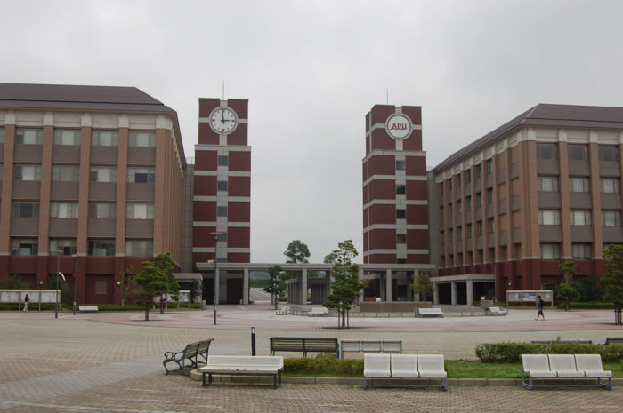 The iconic dual clocktowers of APU's main entrance.