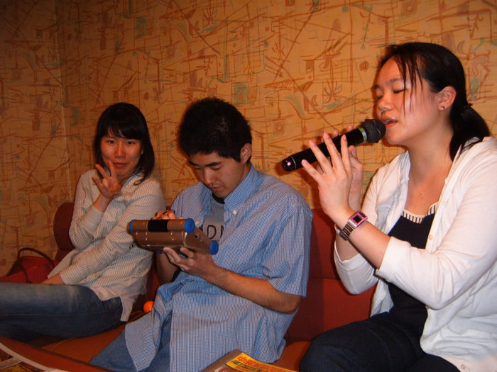 Satoshi queuing up tunes on the wireless control pad.